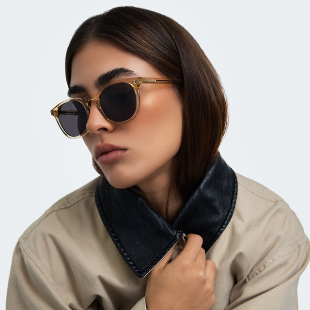 Woman in a trench coat wearing Eldridge 56 Sunglasses Citrine with Grey Flat