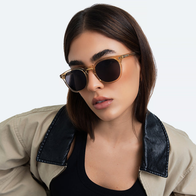 Another angle of woman in a trench coat wearing Eldridge 56 Sunglasses Citrine with Grey Flat