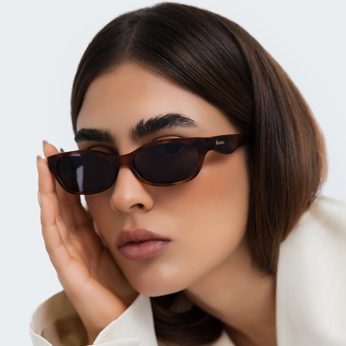 Woman wearing Encinitas Sunglasses in Havana with Grey lenses, side profile, Close up of a woman in a studio
