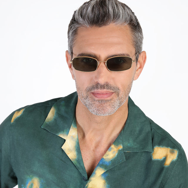 Model with beard wearing Flushing Sunglasses Gold with Olive Flat