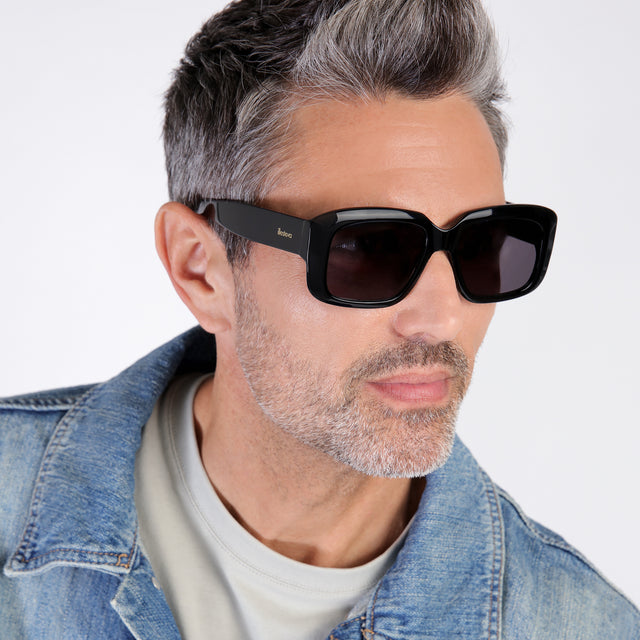 wearing Geno Sunglasses Black with Grey