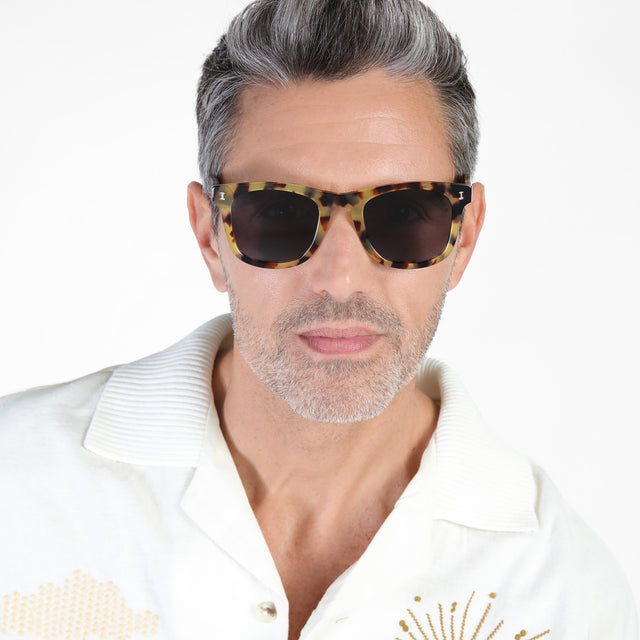 Model with salt and pepper hair and beard wearing James Sunglasses Tortoise with Grey