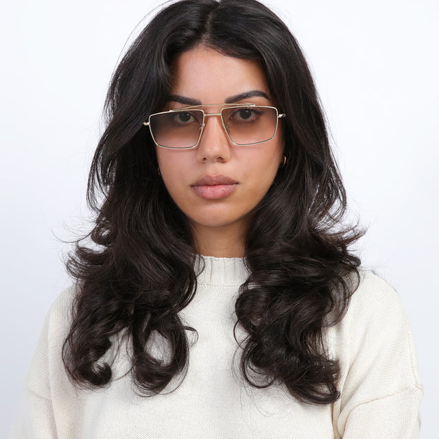 Brunette model wearing Jane Sunglasses Gold with Taupe Gradient