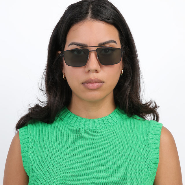 Brunette model wearing Jane Sunglasses Matte Black with Olive