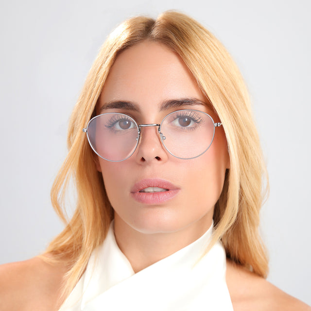 Blond woman in a white silk halter top wearing Jefferson Optical Gunmetal Optical