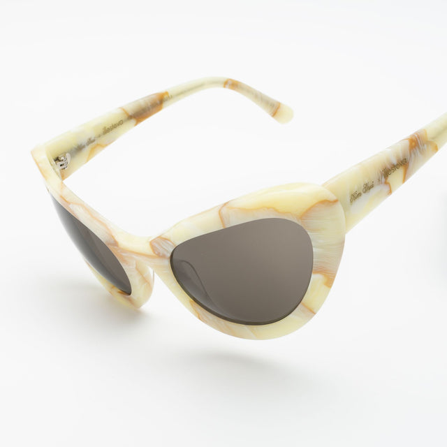 Close up of Kim Shui Sunglass temples  Savannah Cream Marble with Grey 