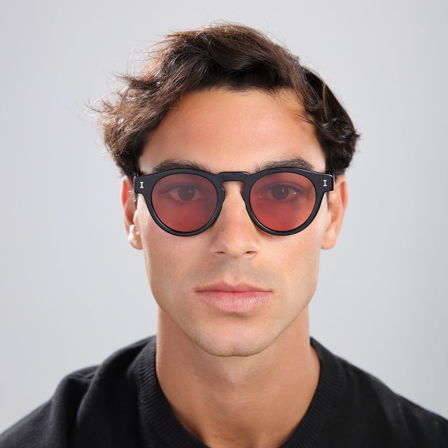Man in a black tee wearing Leonard Sunglasses Black with Bordeaux See Through