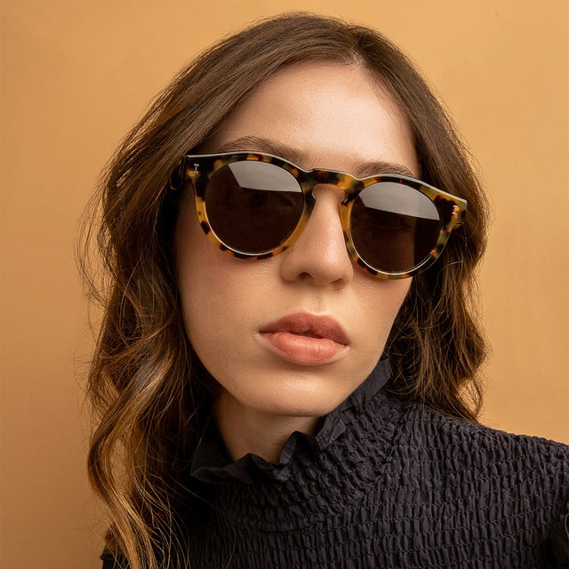 Brunette model wearing Leonard (Classic Flex Hinge) Sunglasses Honey Tortoise with Grey