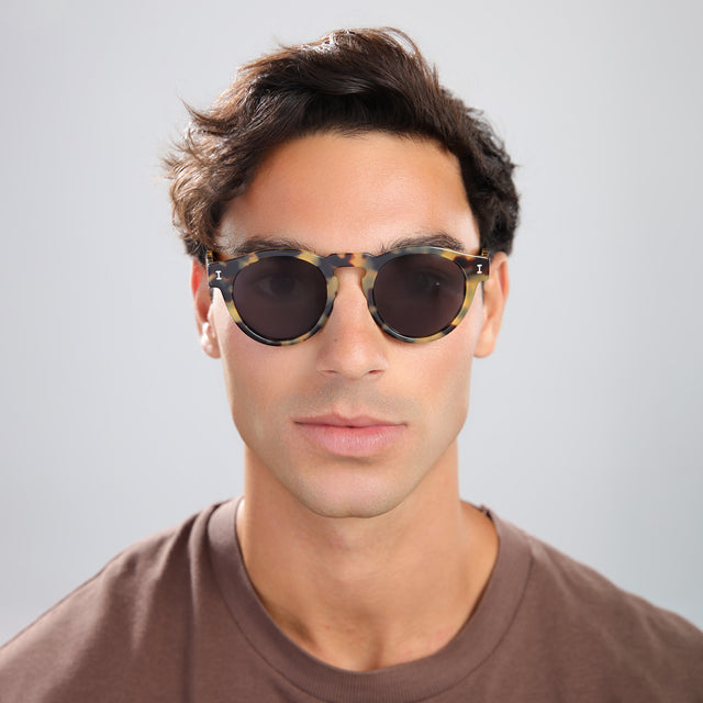 Another angle of man in a brown tee wearing Leonard Sunglasses Tortoise with Grey
