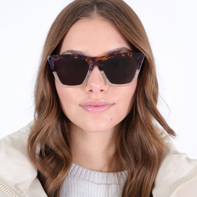 Brunette model with loose curls wearing Lisbon Sunglasses H/H Rum Raisin Bone with Grey