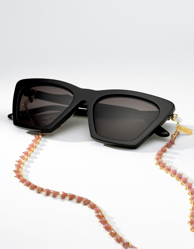 Black Lisbon sunglasses with a colorful beaded sunglass chain on a white background