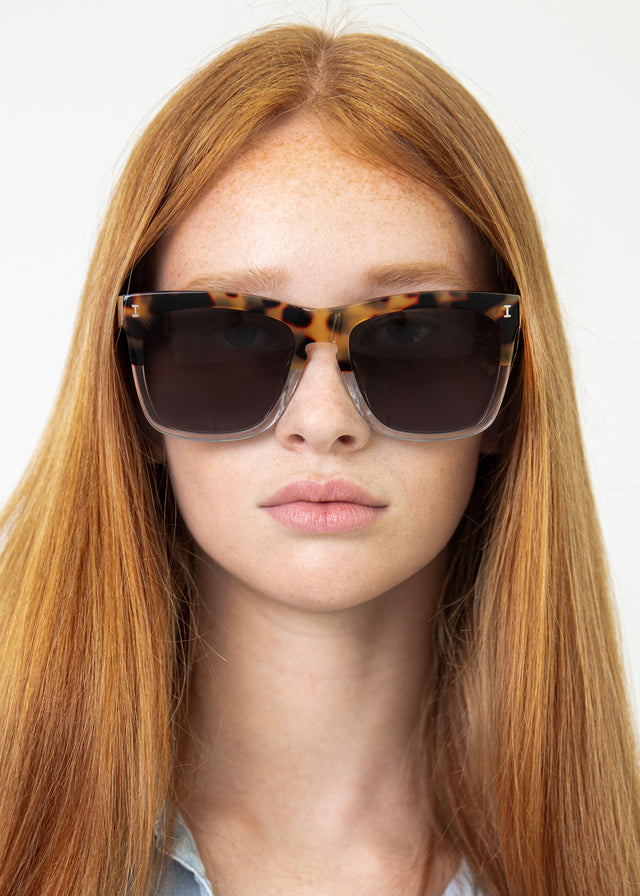 Model with straight red hair wearing Los Feliz Sunglasses Half Half Tortoise with Grey