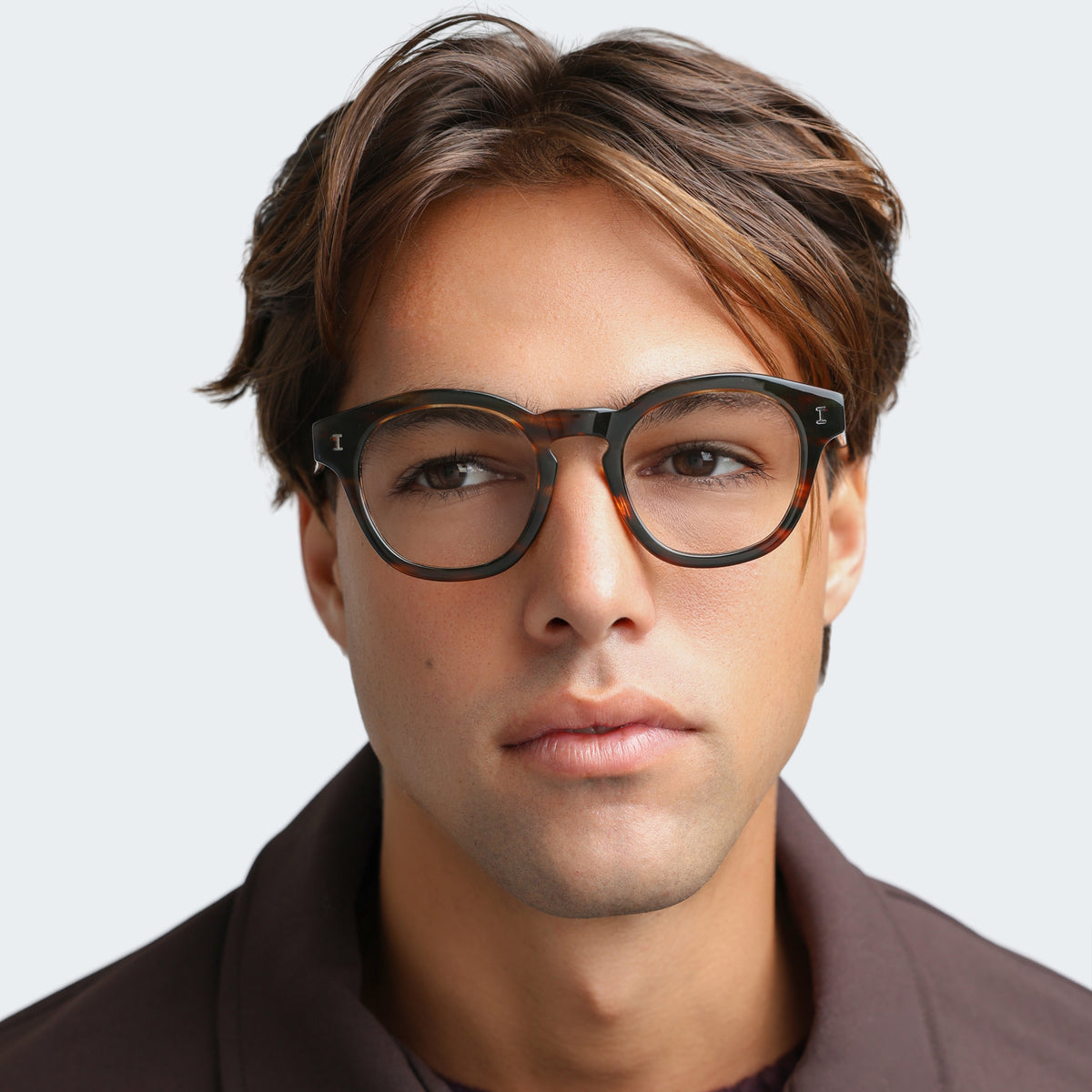 Man wearing Madison Optical in Sand Dune Optical, front view, Man in a brown jacket