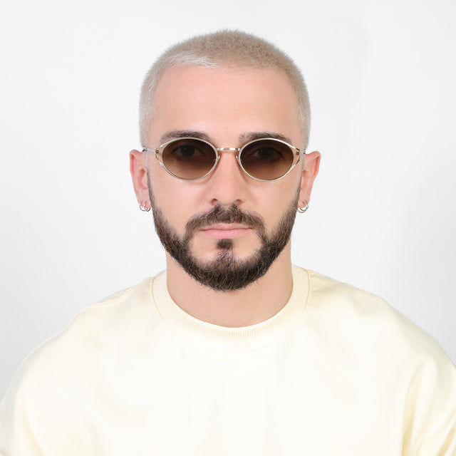 Model with platinum buzzcut wearing Maria Sunglasses Rose Gold with Taupe Gradient