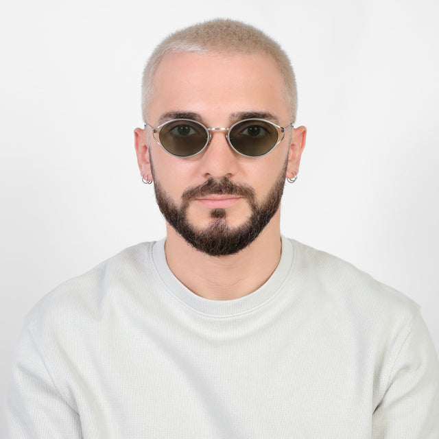 Model with platinum buzzcut wearing Maria Sunglasses Silver with Olive