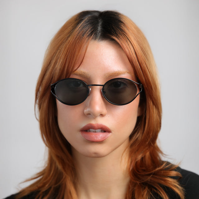 Model with red hair wearing Maria Sunglasses Black with Grey