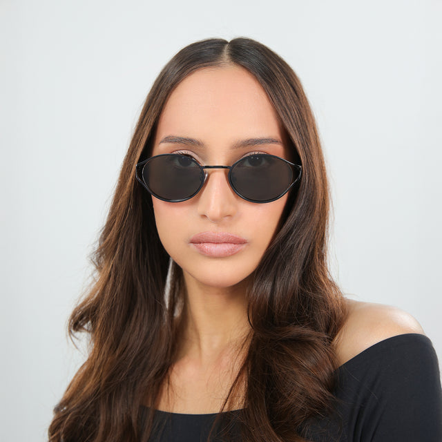 Woman in an off-the-shoulder blouse wearing Maria Sunglasses Black with Grey