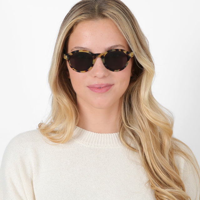 Blonde model wearing Medellin Sunglasses Tortoise with Grey