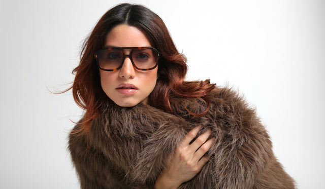 Woman in a faux fur coat wearing Memphis in Havana with Taupe Gradient