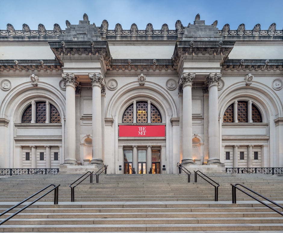 Exterior of the Met Museum in New York, featuring the iconic stairs and columns