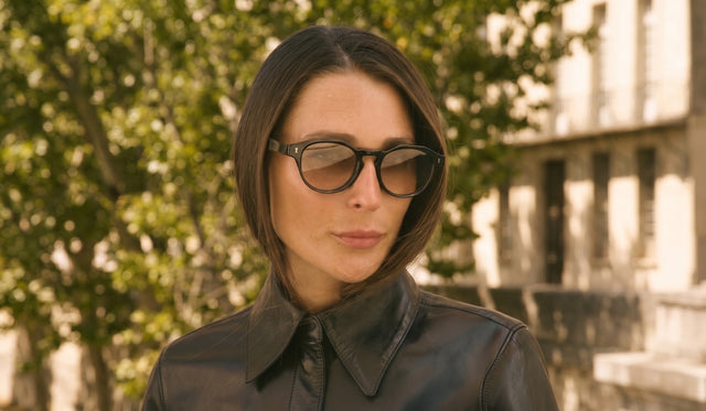 Woman in Paris wearing the Michael Sunglasses and a leather blouse