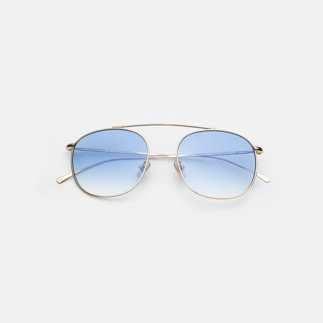 Mykonos M Sunglasses side view in Gold / Blue Flat Gradient See Through