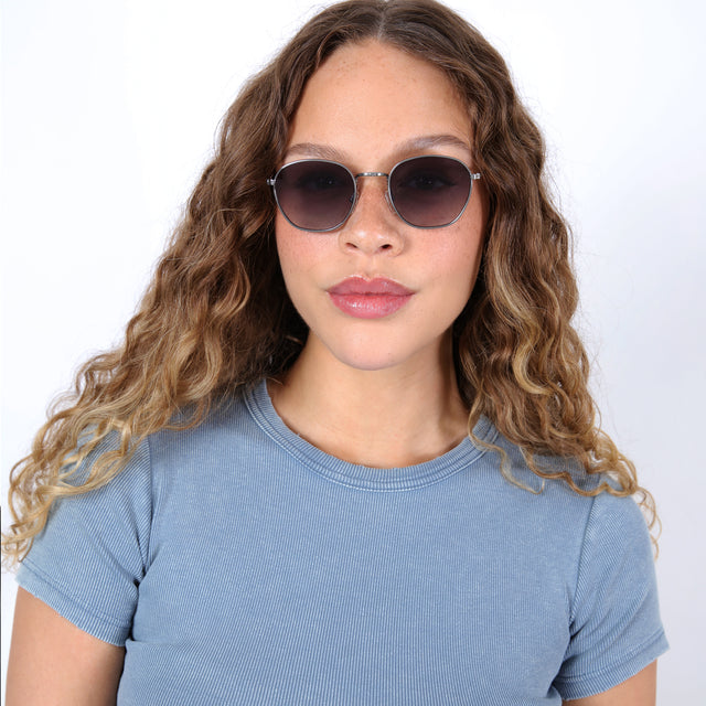 Brunette model with ombré, natural curls wearing Prince Sunglasses Gunmetal with Grey Flat Gradient