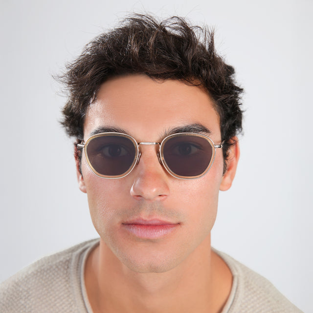 Another angle of man in a beige waffled sweatshirt wearing Prince Tate Sunglasses Citrine/Gold with Grey Flat