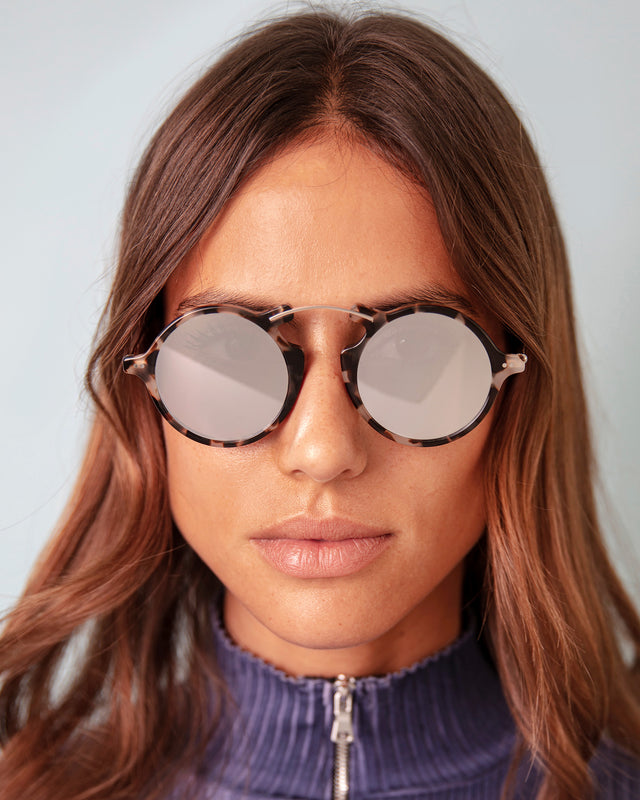 Brunette model with wavy hair wearing Roma II Sunglasses White Tortoise with Silver Flat Mirror