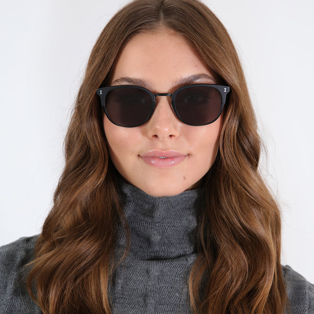 wearing Stockholm Sunglasses Matte Black with Grey