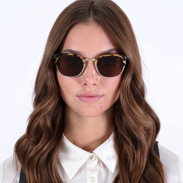 wearing Stockholm Sunglasses Tortoise/Gold with Brown