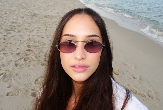 Woman at Miami Beach wearing Sydney Sunglasses in Gunmetal