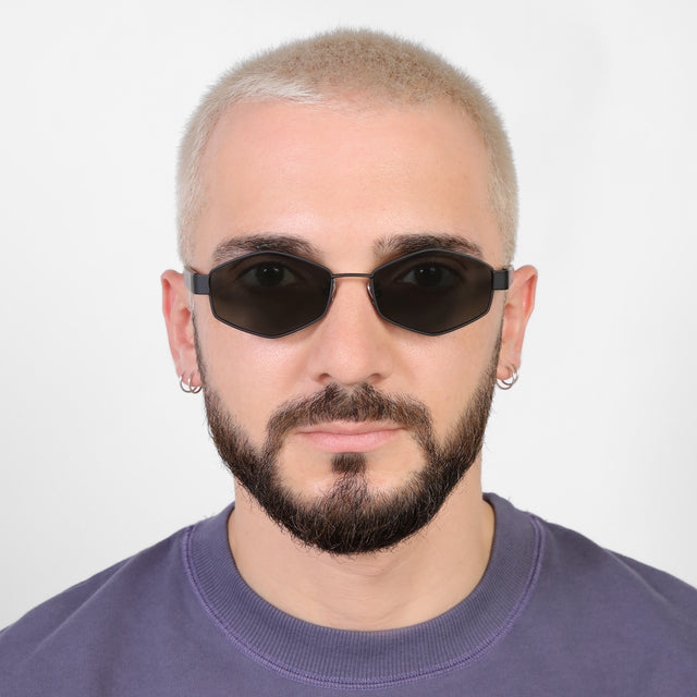 Model with a platinum buzzcut wearing Tucson Sunglasses Matte Black with Grey