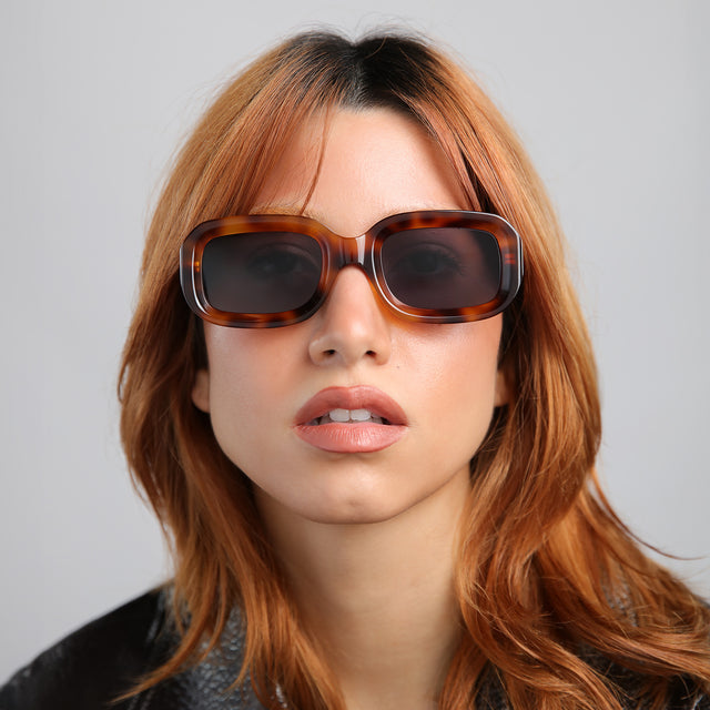 Model with red hair wearing Vinyl Sunglasses Havana with Grey