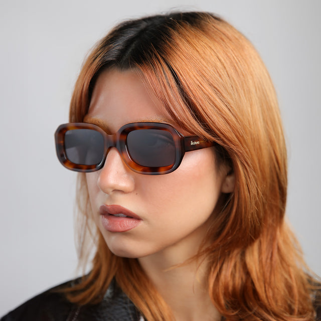 Close up of model with red hair wearing Vinyl Sunglasses Havana with Grey