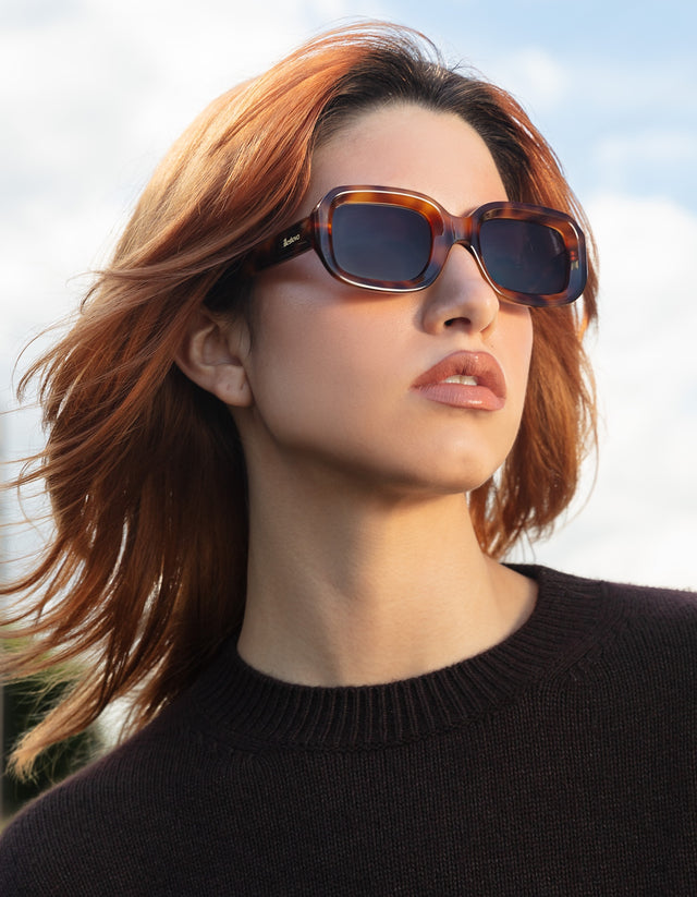 Model near a field wearing Vinyl Sunglasses in Havana