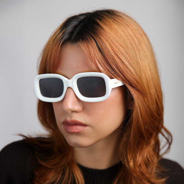 Model with red hair wearing Vinyl Sunglasses White with Grey