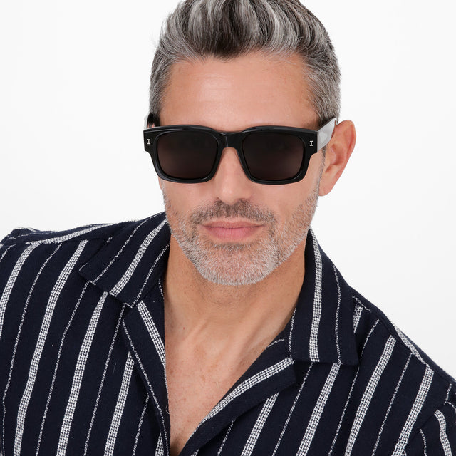 Model with salt and pepper hair and beard wearing Vito Sunglasses Black with Grey