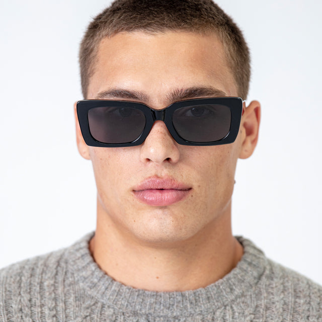 Male model wearing Wilson II Sunglasses Black with Grey Flat