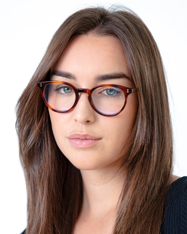 Brunette model wearing Dakota Optical Havana Optical