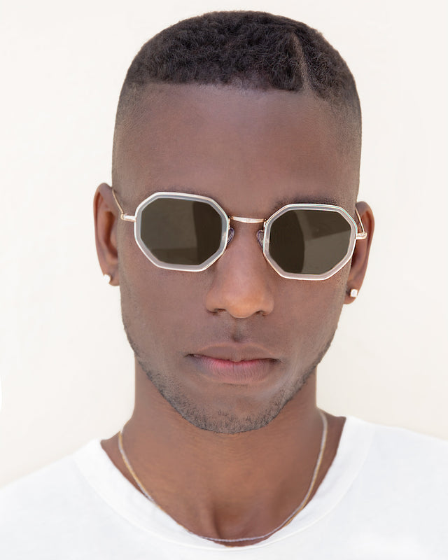 Model with short brown hair wearing Dylan Tate Sunglasses Matte Clear/Gold with Brown Flat