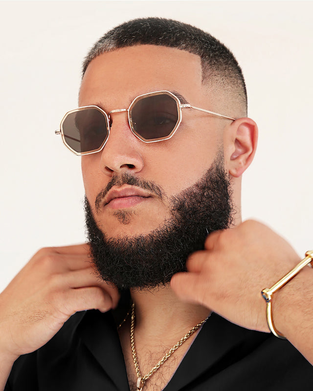 Bearded model with short brown hair wearing Dylan Tate Sunglasses Citrine Gold with Grey Flat