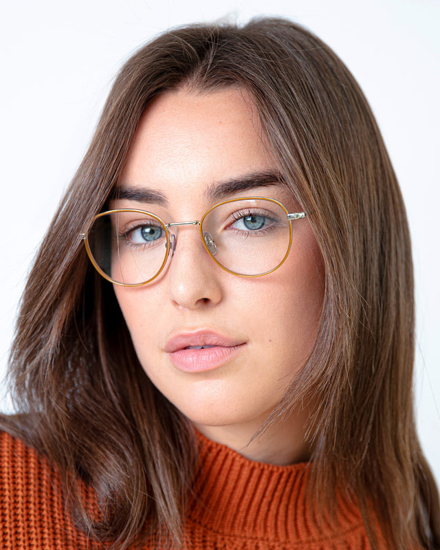 Brunette model wearing London Optical Saddle/Silver with Opticalwearing London Optical Saddle/Silver with Optical