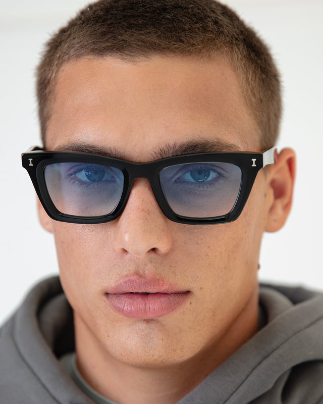 Man with Buzzcut wearing Portugal Sunglasses Black with Blue Flat Gradient See Through