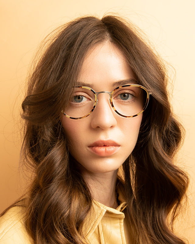 Brunette model with wavy hair wearing Tompkins Titanium Optical Tortoise/Matte Silver Optical