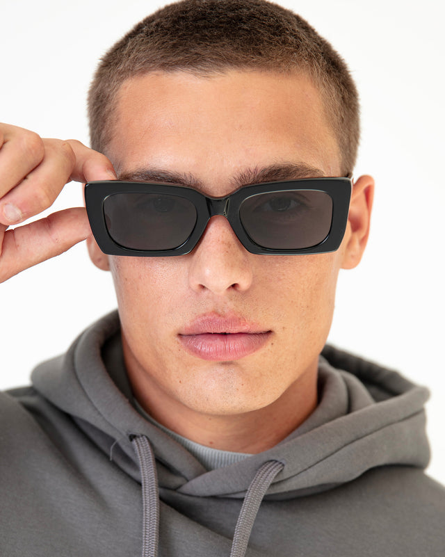 Model with buzzcut wearing Wilson II Sunglasses Black with Grey Flat