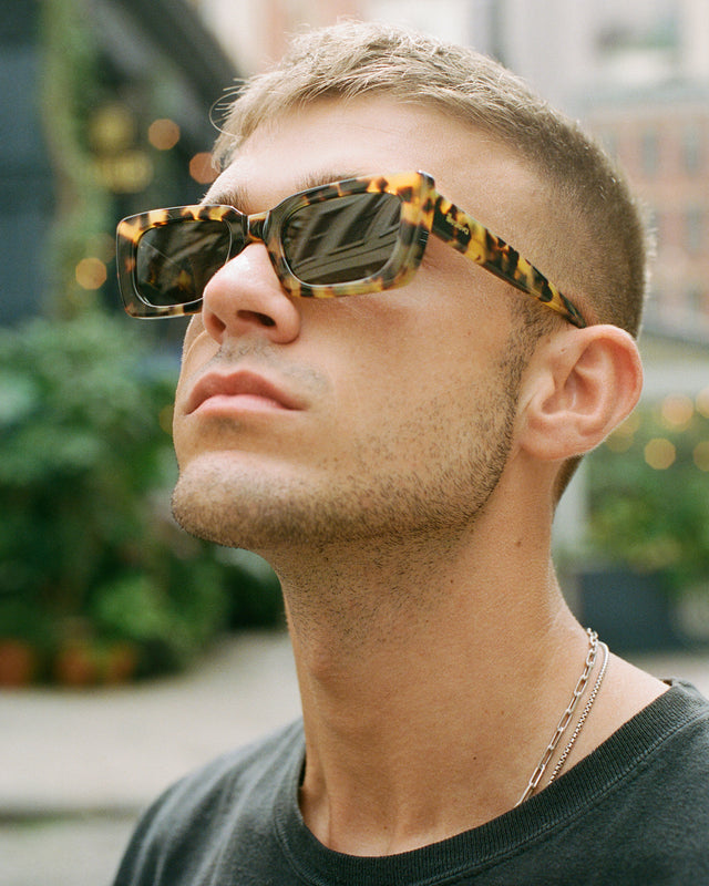 Blonde model with short hair looking up wearing Wilson Sunglasses Tortoise with Grey Flat